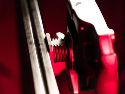 Close-up of a red and silver tool with a blurred background