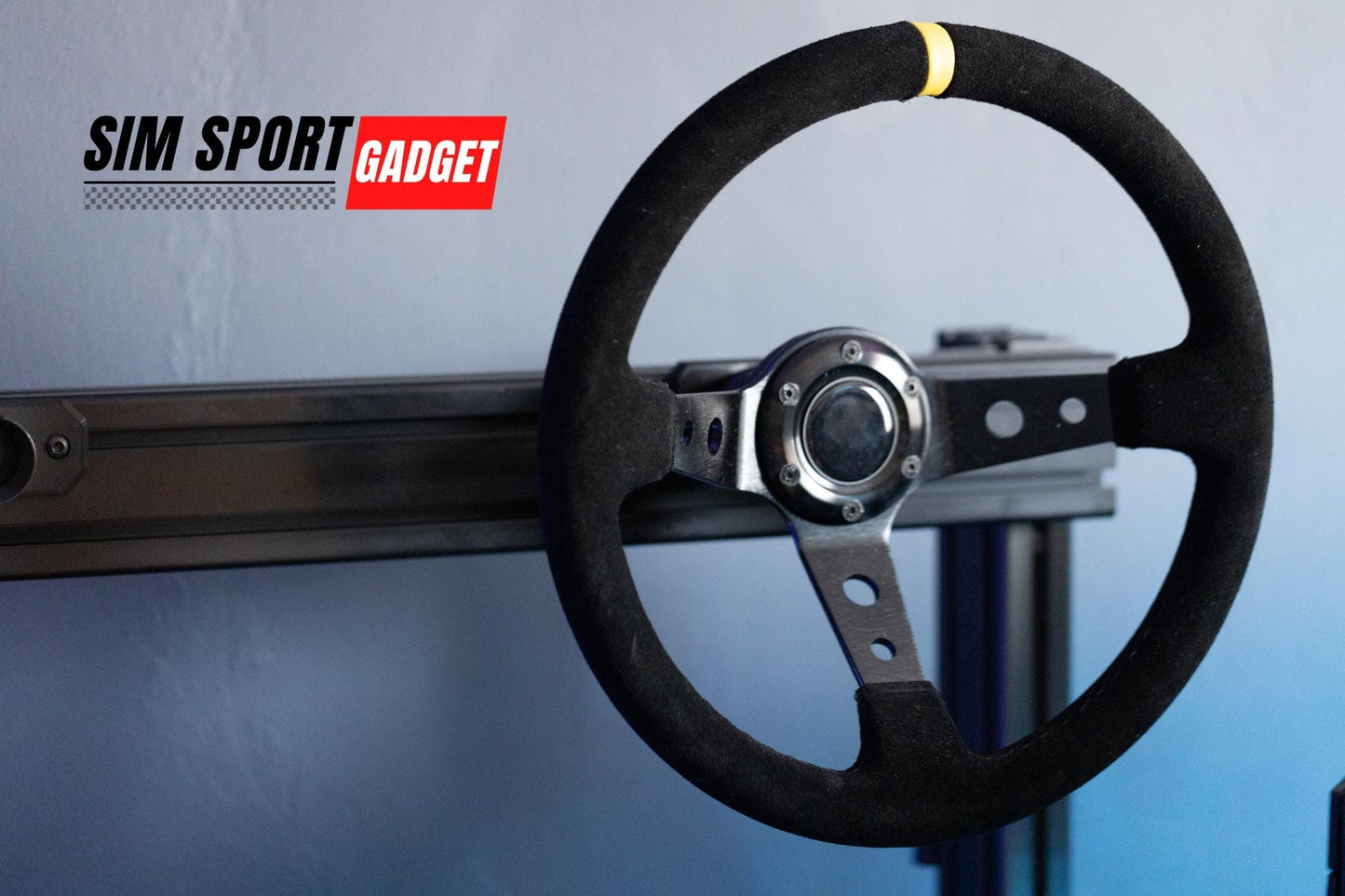 Black steering wheel with silver center on a blue background, featuring 'Sim Sport Gadget' logo.