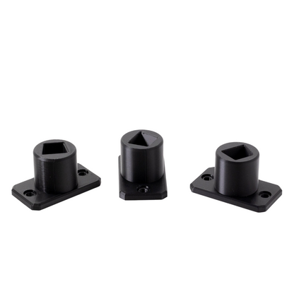 Three black metal brackets on a white background