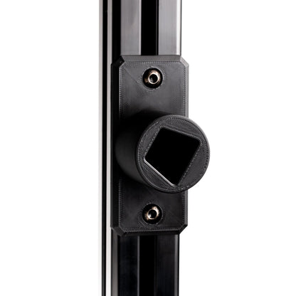 Close-up of a black metal door handle on a white background