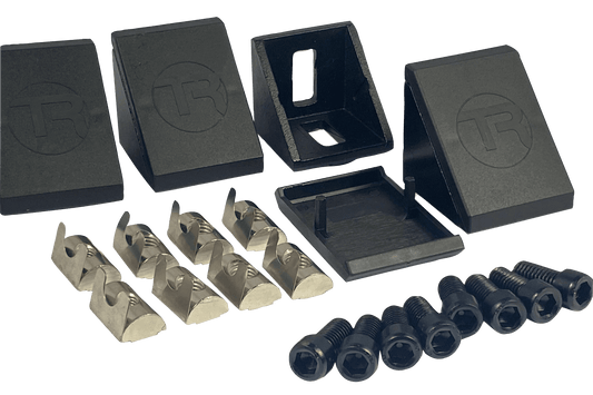 Collection of black plastic components and clear metal bolts on a black background