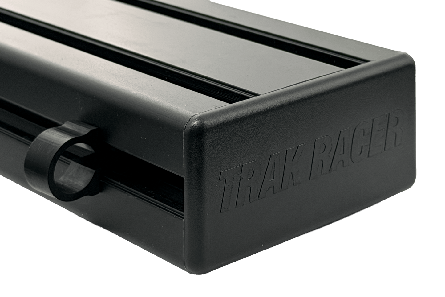 Black metal track with 'Trak Racer' branding on a black background