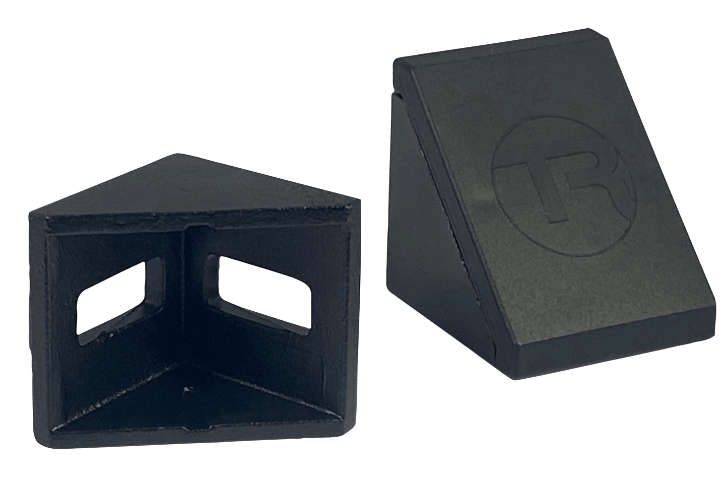 Two black plastic wedges on a white background