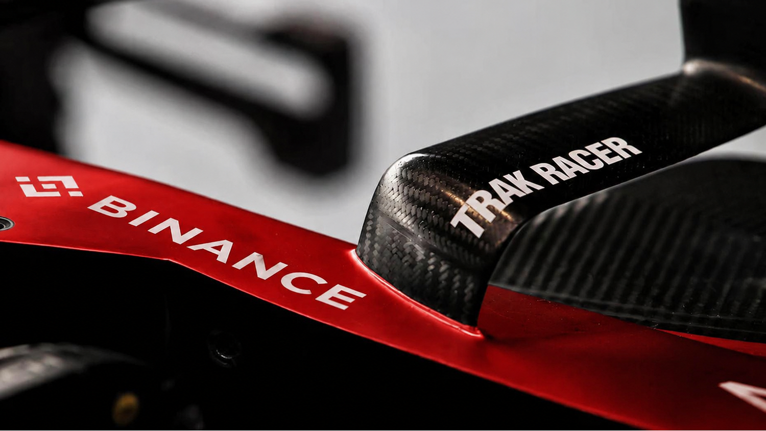 Trak Racer branding displayed on real-world motorsport vehicle