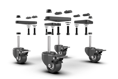 Set of black caster wheels and hardware on a green background
