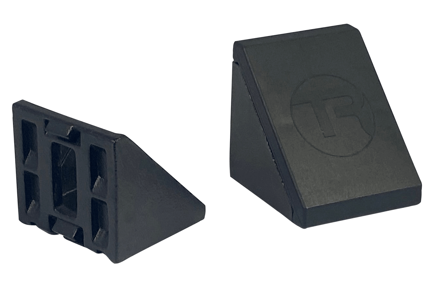 Two gray plastic wedges on a black background
