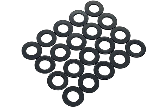 Multiple black washers on a white background