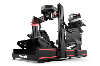 Black and red racing simulator setup with 'Trax Racer' branding on a green background
