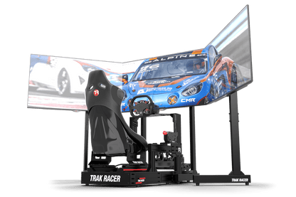 Racing simulator setup with a chair and screens displaying racing game graphics.