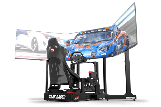 Racing simulator setup with a chair and screens displaying racing game graphics.