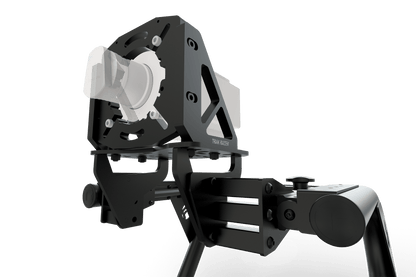 Black and gray mechanical device on a green background