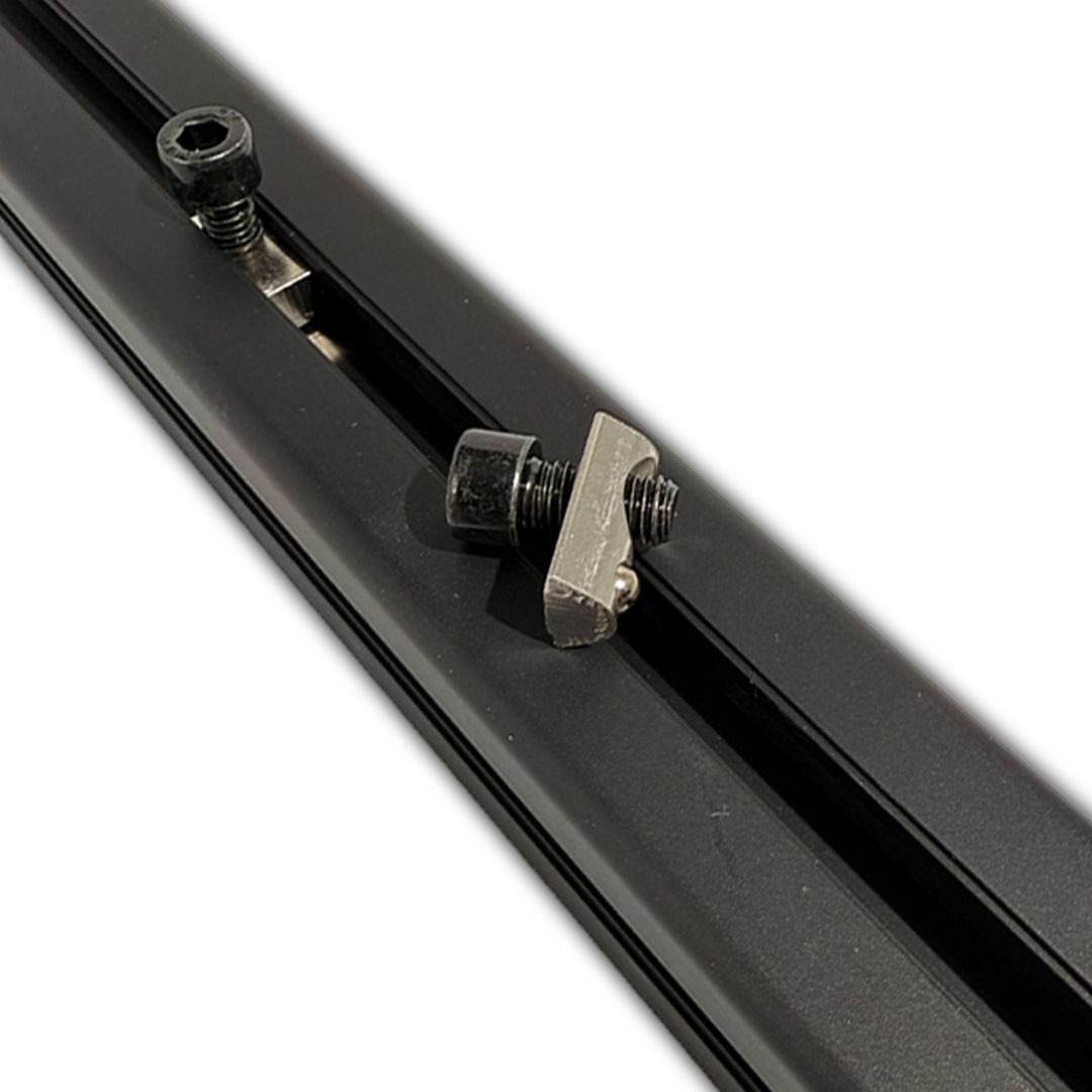 Close-up of a black metal rod with a clamp and screws on a white background
