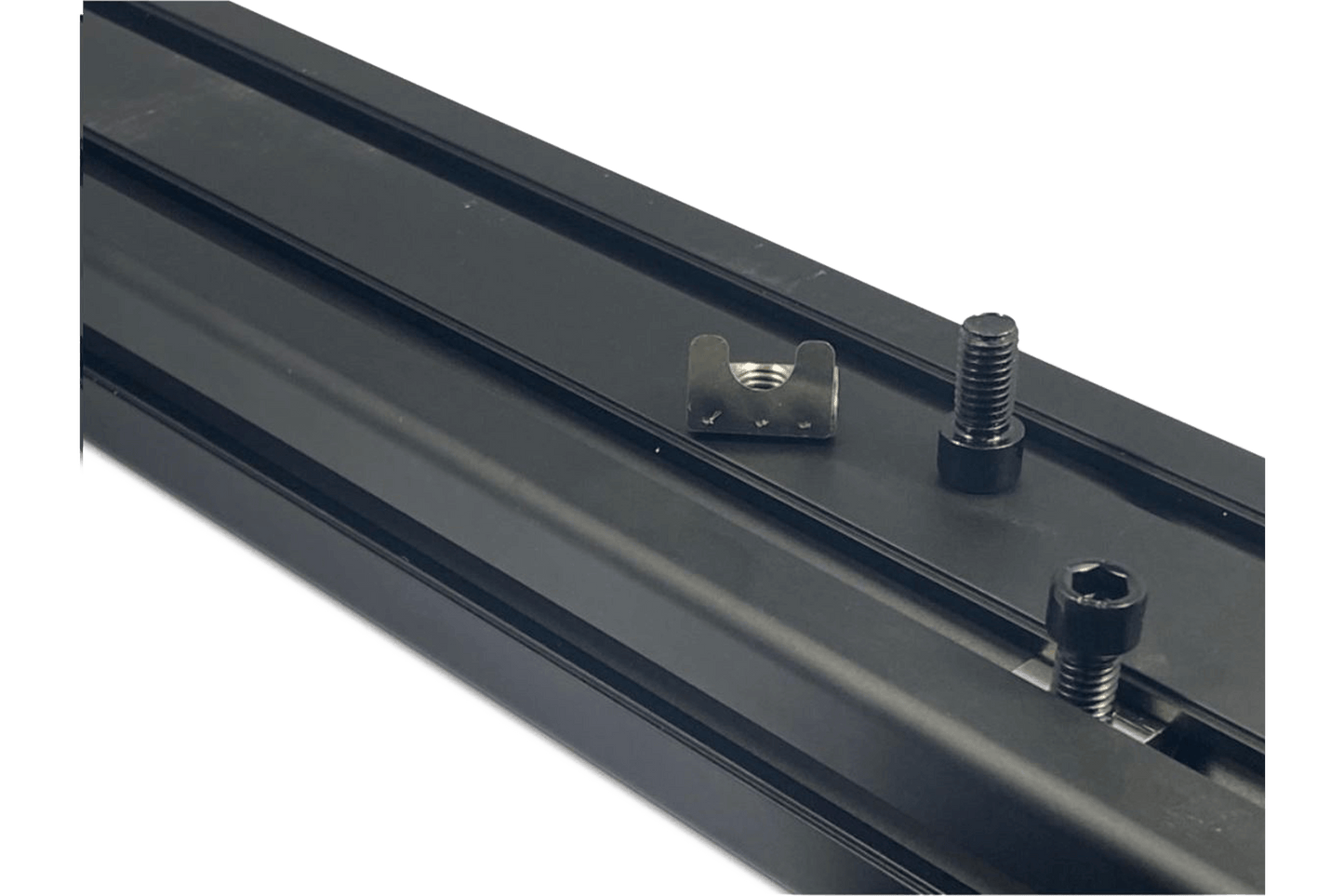 Metal track with mounting hardware on a black background