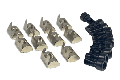 Set of metal clips and a black plastic component on a white background