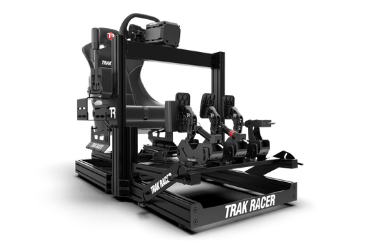 Black 'Trak Racer' mechanical device on a green background