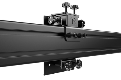Close-up of a black metal rod with attached components on a white background