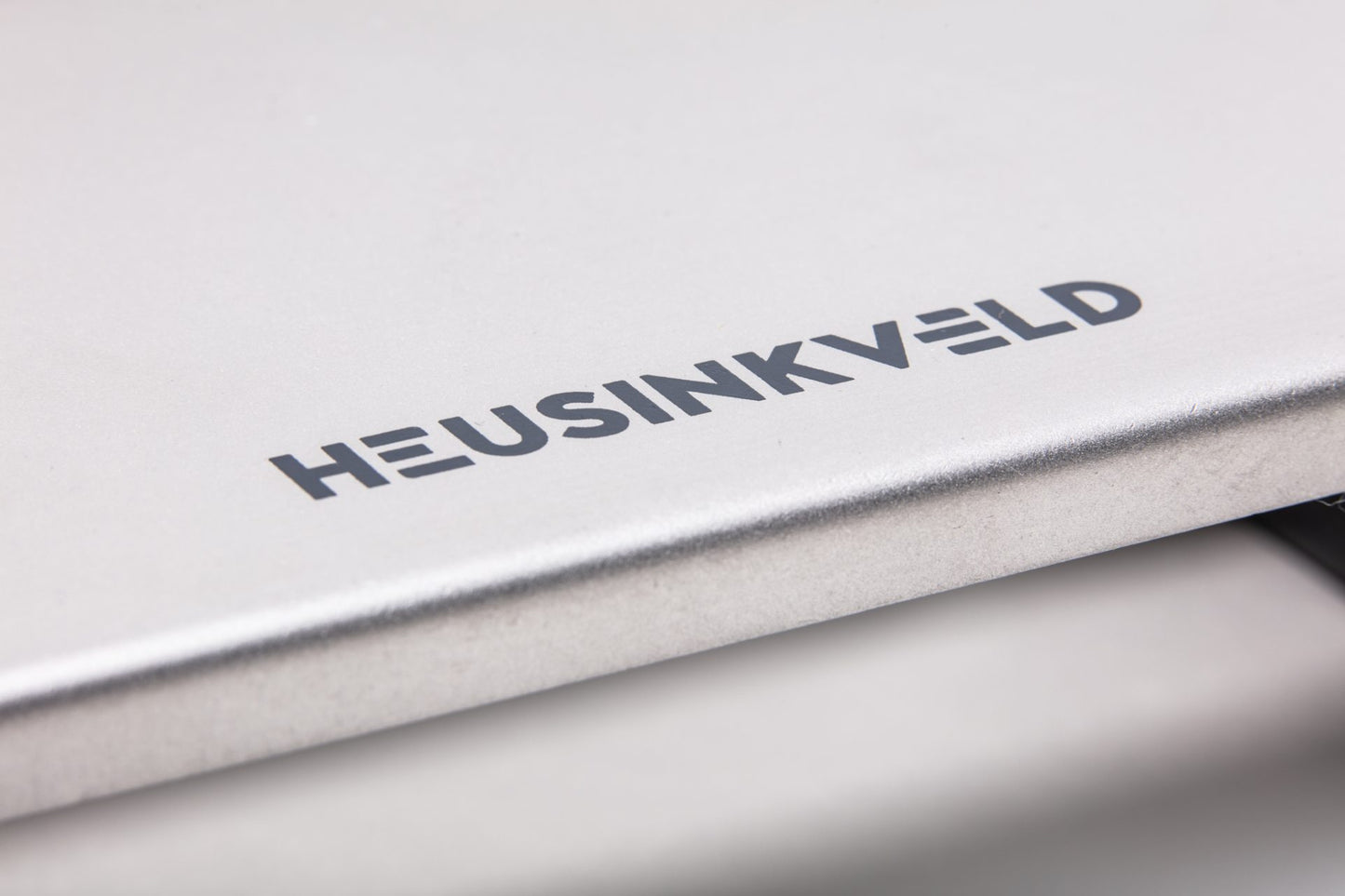 Heusinkveld baseplate close up of logo detail