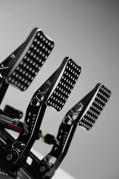 Simagic P2000 sim racing pedals installed in racing setup